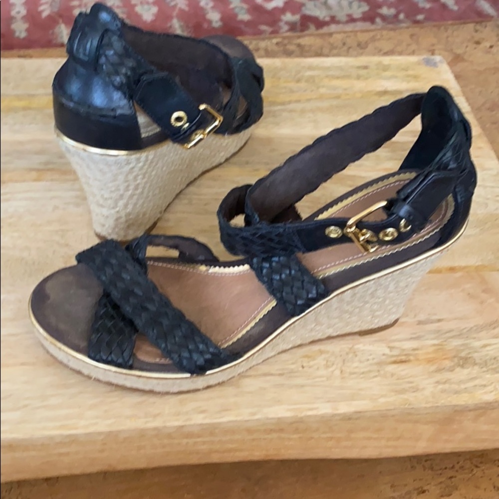 Sperry’s Black wedge with straps and buckle.